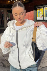 Sweat à capuche zippé à manches larges en losanges