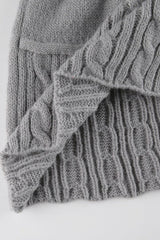 Jupe de Noël en tricot torsadé à pompons