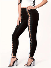 Leggings noirs moulants et sexy pour femmes, avec patchwork et laçage à neuf points sur le devant.