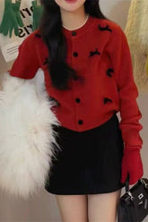 Gilet de Noël en maille à col rond et nœud papillon