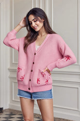 Gilet de Noël tricoté à col V et motif bottes