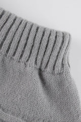 Jupe de Noël en tricot torsadé à pompons