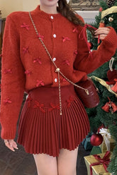 Gilet de Noël court en grosse maille avec nœud papillon