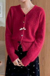 Gilet de Noël à col en V et boutons, orné d'un nœud papillon