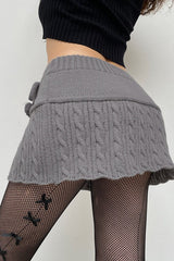 Jupe de Noël en tricot torsadé à pompons