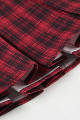 Robe courte à carreaux color block, épaules dénudées et poignets à pompons