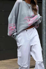 Pull contrasté à effet usé