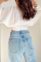 Blouse courte nouée à manches chauve-souris