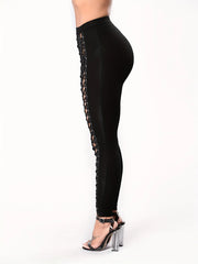 Leggings noirs moulants et sexy pour femmes, avec patchwork et laçage à neuf points sur le devant.