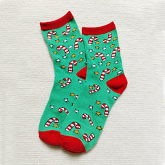 Chaussettes de Noël à motif d'élan, de Père Noël et de bonhomme de neige.