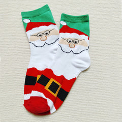 Chaussettes de Noël à motif d'élan, de Père Noël et de bonhomme de neige.