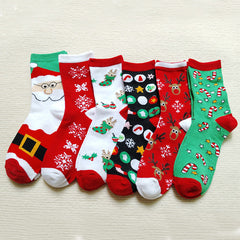 Chaussettes de Noël à motif d'élan, de Père Noël et de bonhomme de neige.