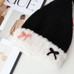 Bonnet de Noël tricoté avec nœud en velours