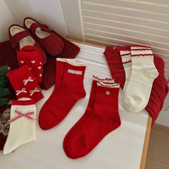 Chaussettes de Noël mignonnes mi-mollet à nœud papillon