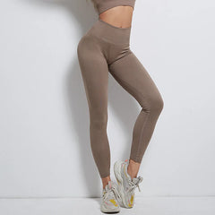 Leggings de sport côtelés élastiques à taille haute rayés sans coutures pour femme, parfaits pour le yoga et le fitness.