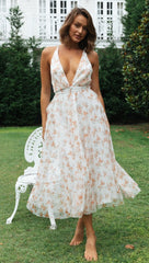 Robe midi smockée à fleurs mélancoliques