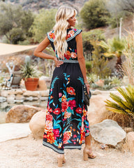 Robe longue Leander à volants asymétriques et fleuries 